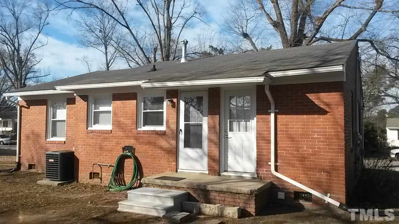 1144 Brighton Road Raleigh, NC 27610 - Photo 20 of 24 a front view of a house with a yard