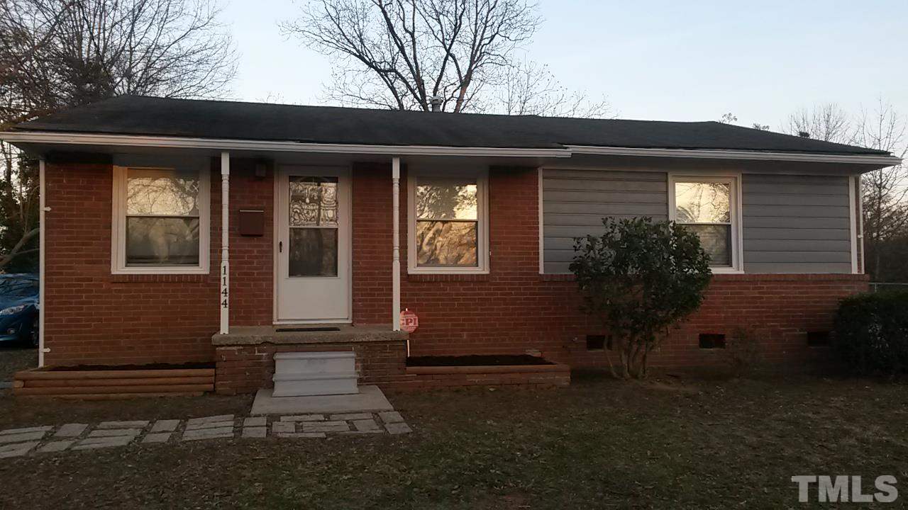 1144 Brighton Road Raleigh, NC 27610 - Photo 3 of 24 a front view of a house with garden