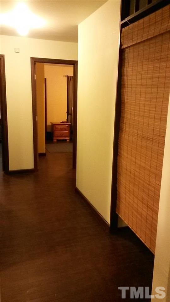 1144 Brighton Road Raleigh, NC 27610 - Photo 9 of 24 a view of a hallway with wooden floor