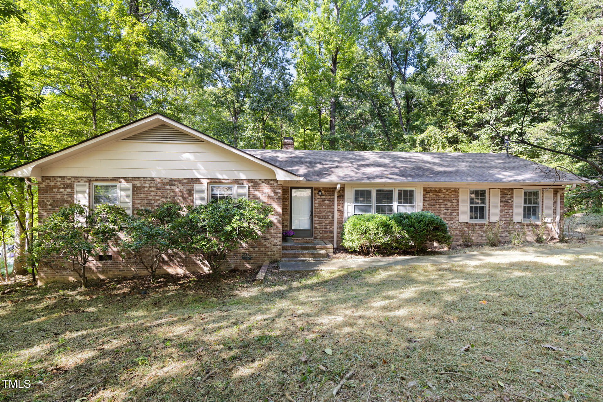 324 Woodhaven Road Chapel Hill, NC 27514 - Photo 1 of 32 a front view of a house with a yard