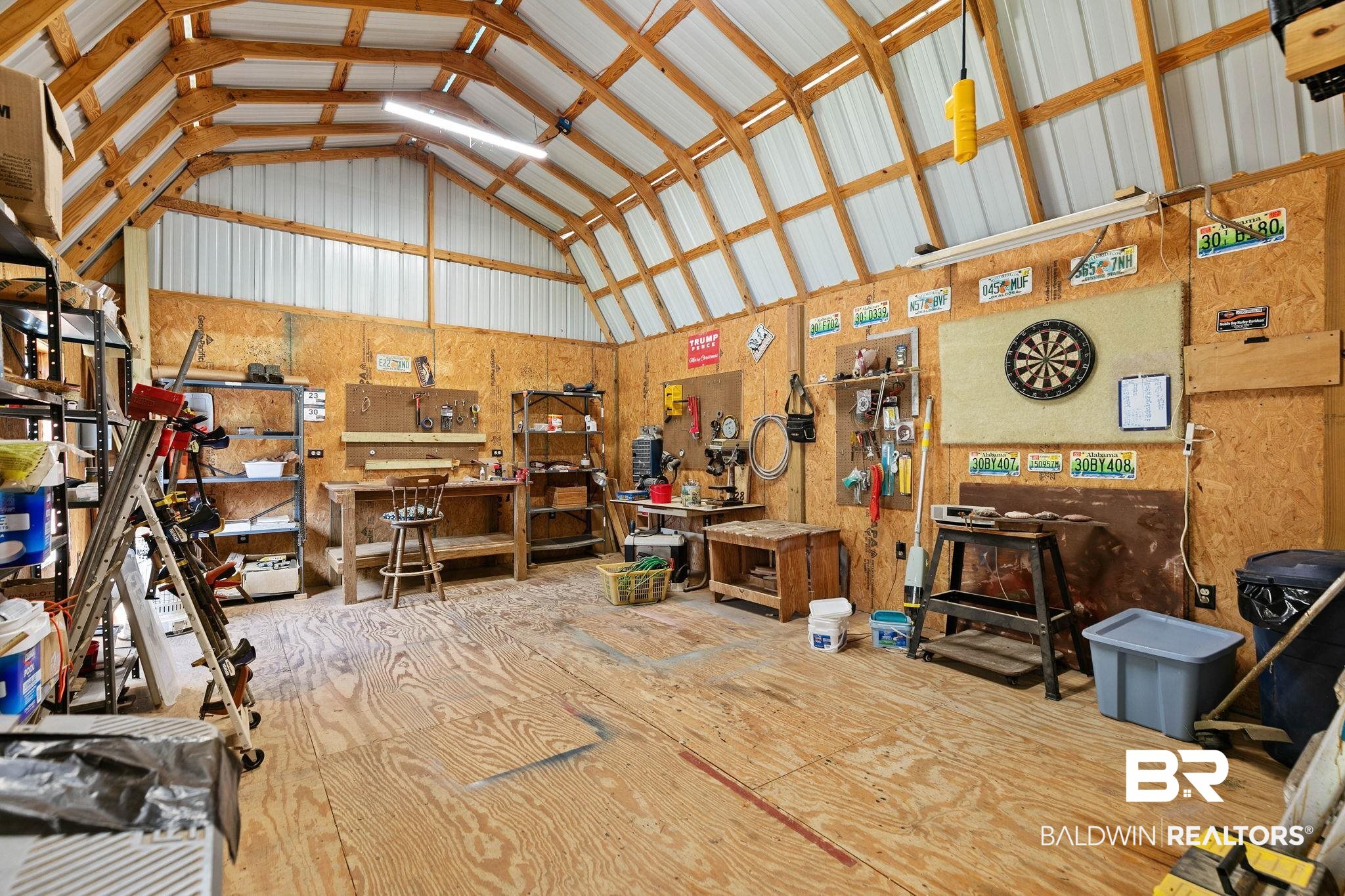 724 Rowell Lane Brewton, AL 36426 - Photo 33 of 40 Garage with a workshop area and metal wall