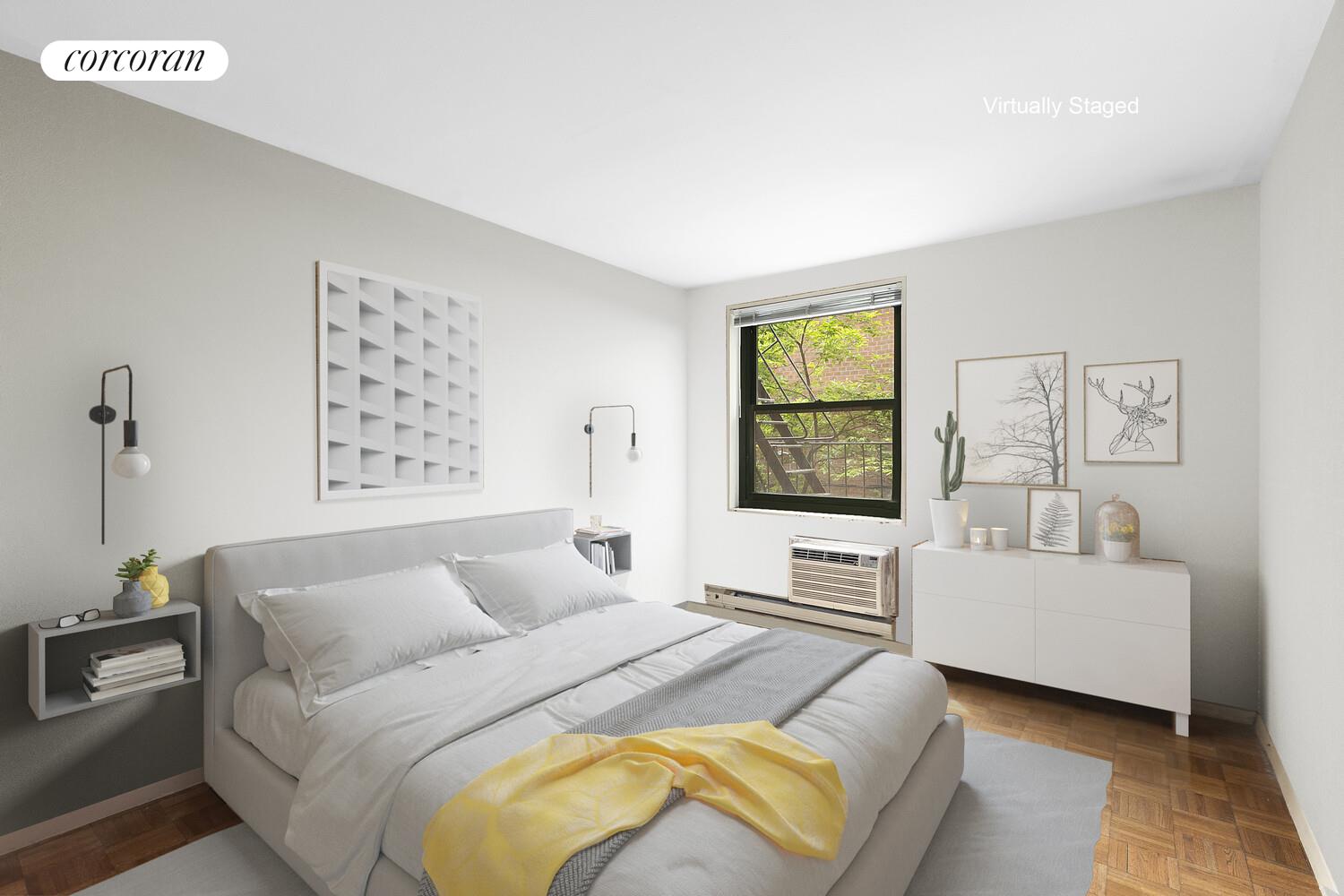 618 Washington Street, Unit GA Manhattan, NY 10014 - Photo 8 of 14 a bedroom with a bed and a couch