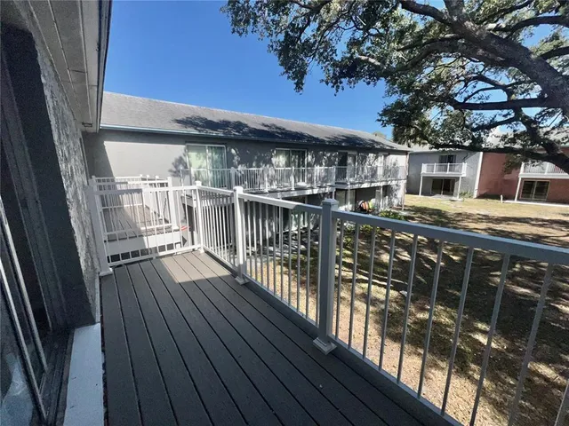 a view of a house with roof deck front of house