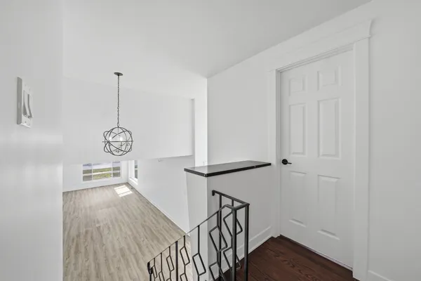 a view of entryway with wooden floor