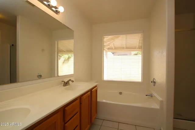 a bathroom with a bathtub and a sink