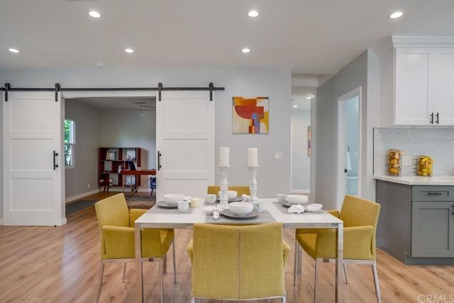 a dining room with a table and chairs