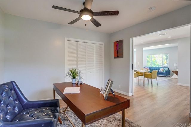a view of an empty room and wooden floor