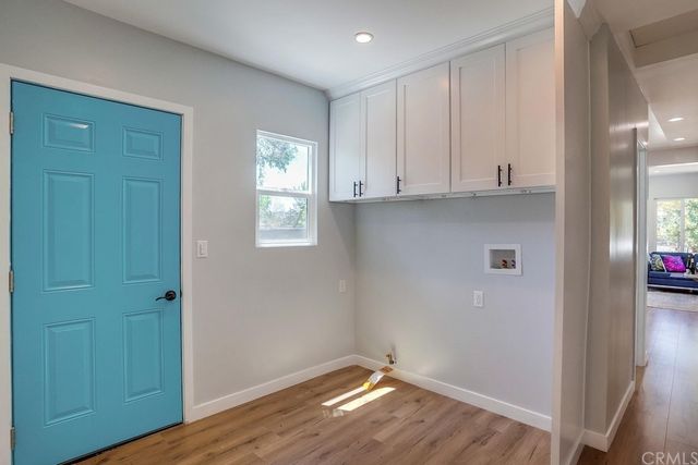 a view of sitting area with furniture in wooden floor