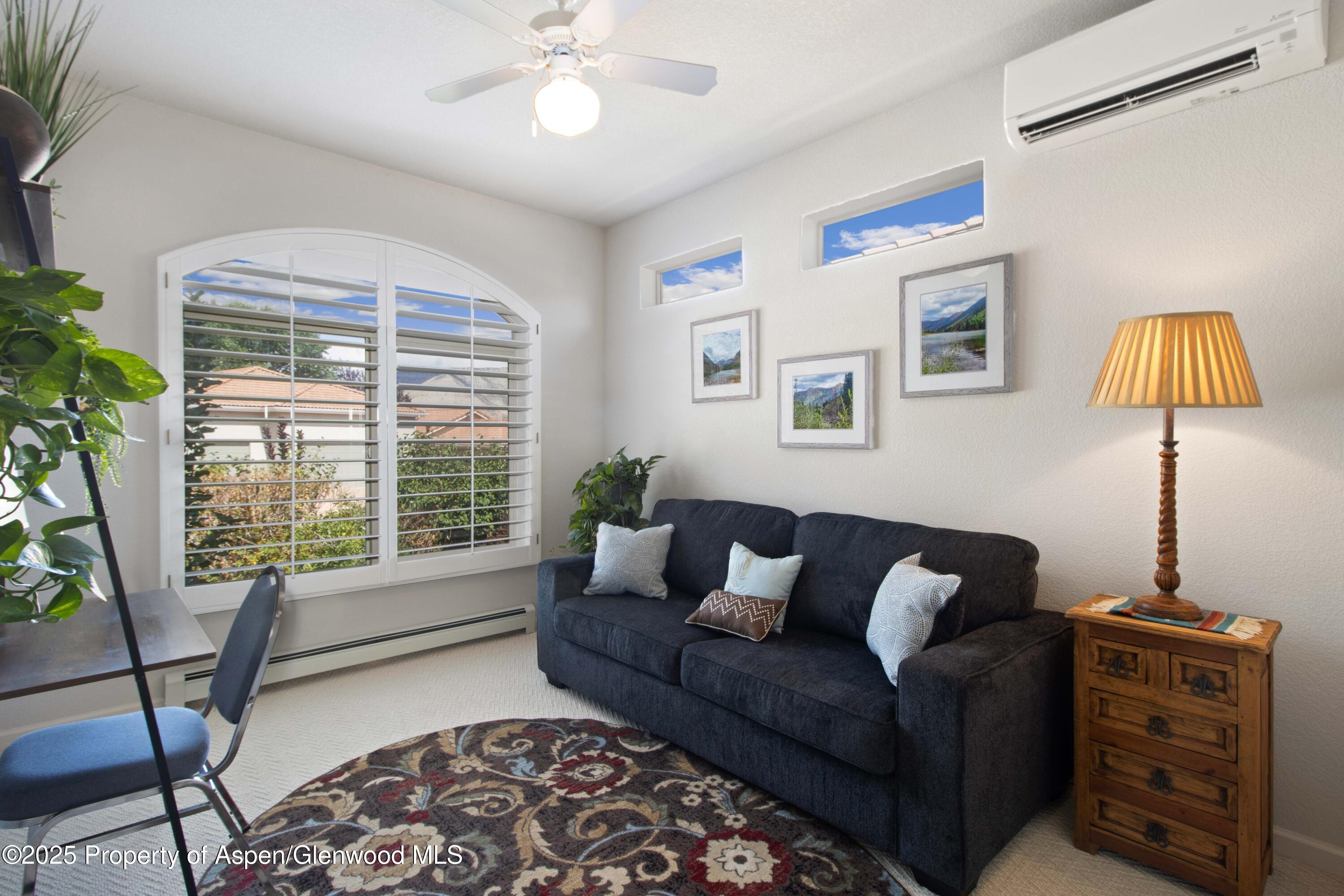 74 Hogan Circle Parachute, CO 81635 - Photo 12 of 26 a living room with furniture and a window
