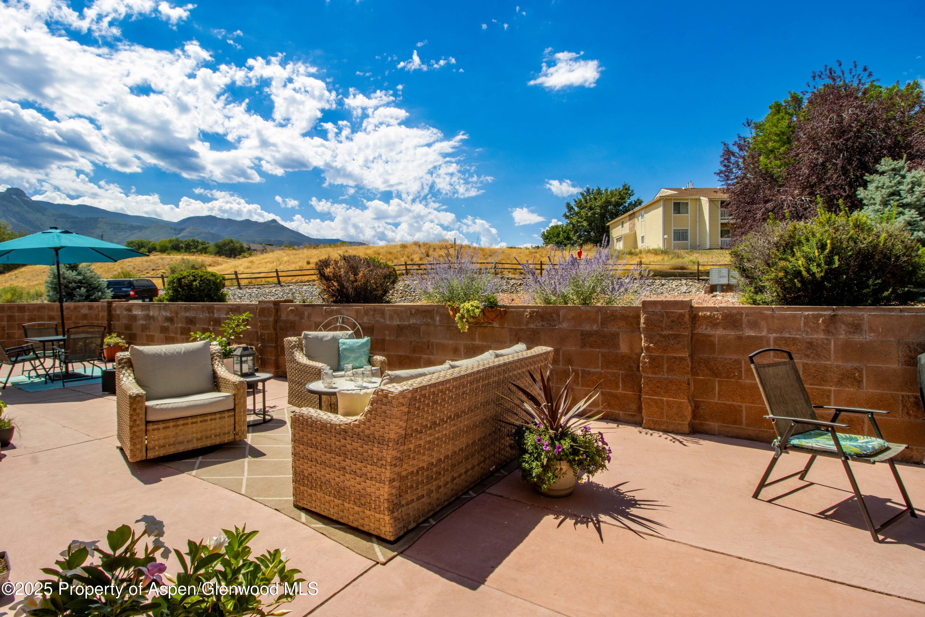 74 Hogan Circle Parachute, CO 81635 - Photo 19 of 26 a view of a terrace with furniture and a potted plant