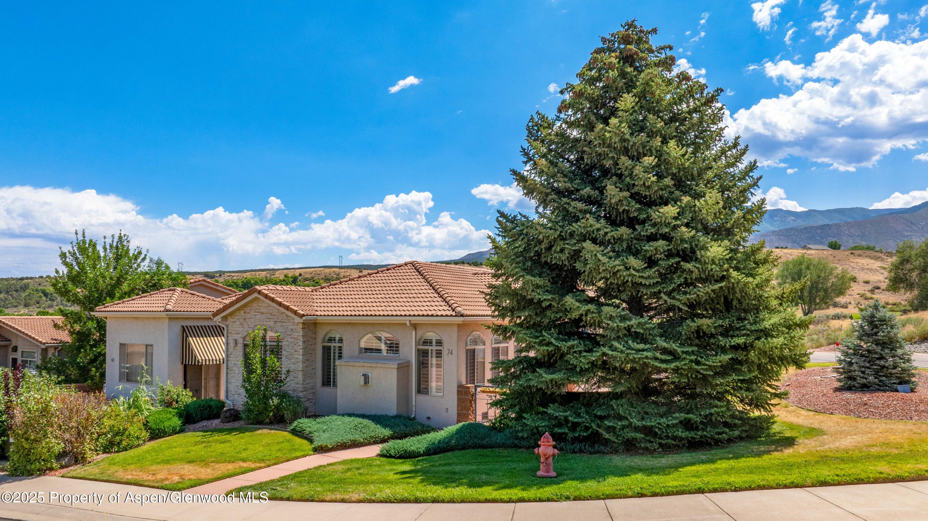 74 Hogan Circle Parachute, CO 81635 - Photo 20 of 26 a front view of a house with garden