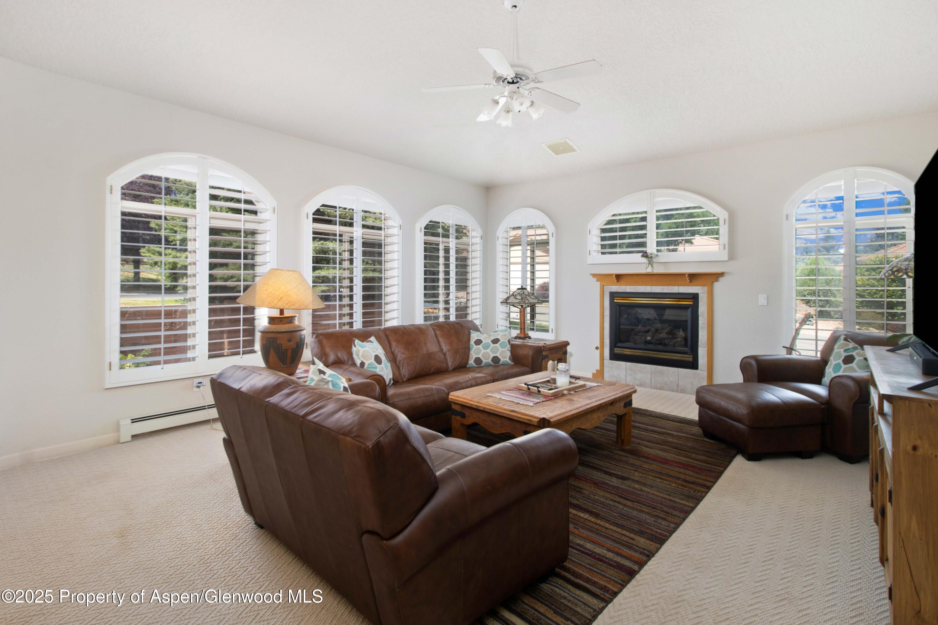 74 Hogan Circle Parachute, CO 81635 - Photo 2 of 26 a living room with furniture large window and fireplace