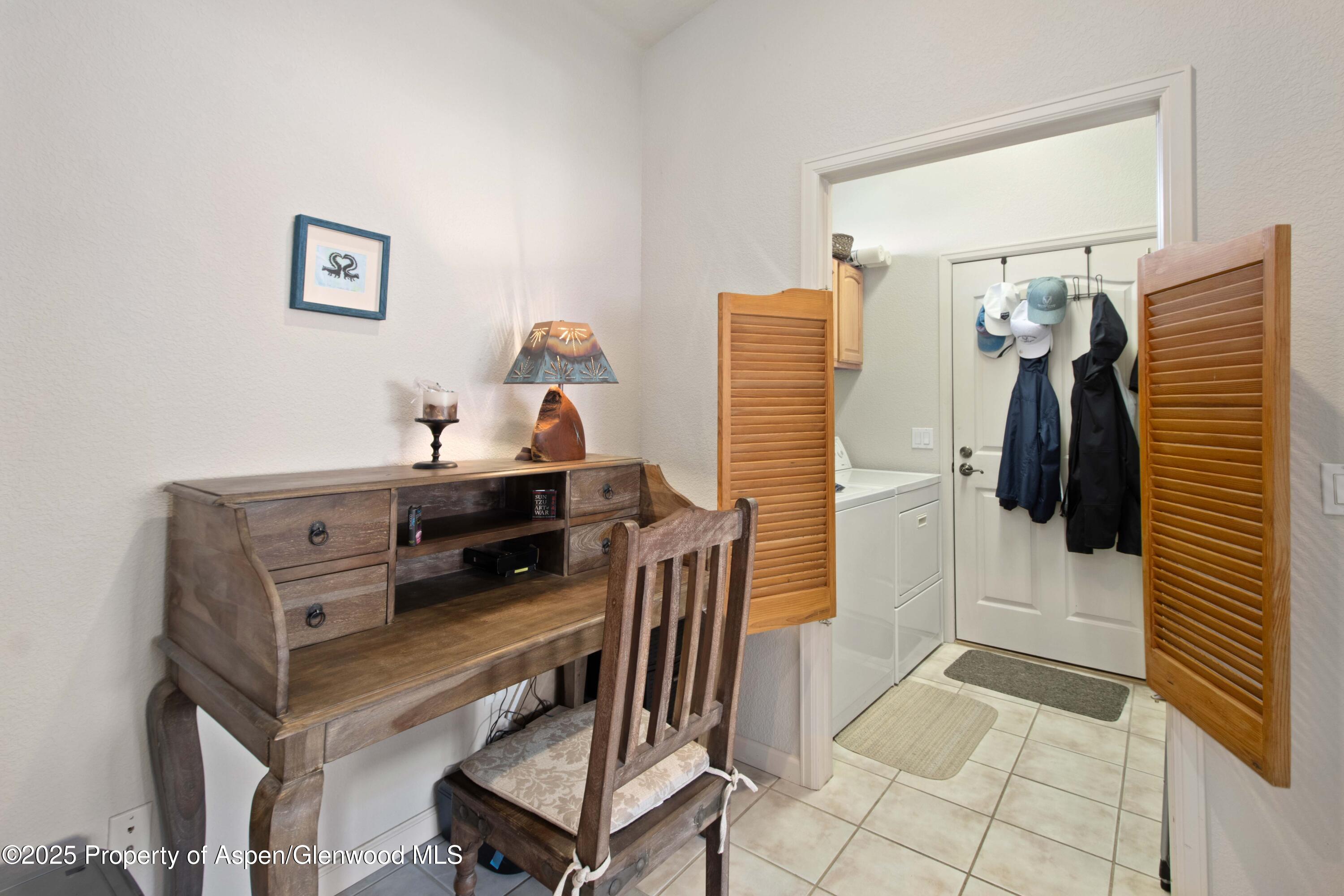 74 Hogan Circle Parachute, CO 81635 - Photo 10 of 26 a bedroom with a bed and a walk in closet