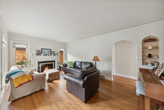 1220 South Fairview Avenue Park Ridge, IL 60068 - Photo 2 of 19 a living room with furniture and a fireplace