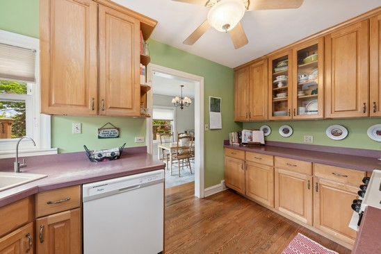 1220 South Fairview Avenue Park Ridge, IL 60068 - Photo 6 of 19 a kitchen with stainless steel appliances a sink a stove and cabinets