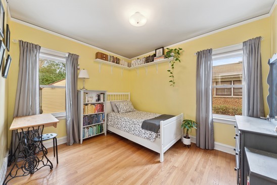 1220 South Fairview Avenue Park Ridge, IL 60068 - Photo 8 of 19 a bedroom with a bed and wooden floor