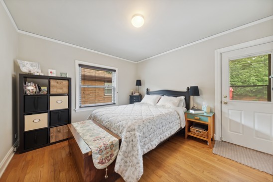 1220 South Fairview Avenue Park Ridge, IL 60068 - Photo 9 of 19 a bedroom with a bed and a large window