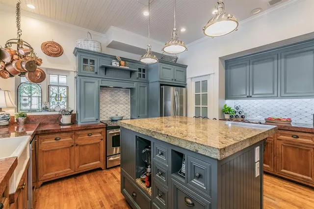 a kitchen with a stove and a table
