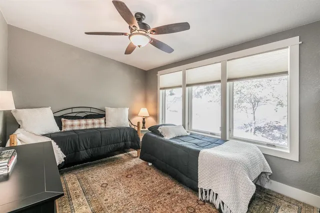 a bedroom with a large bed and a window