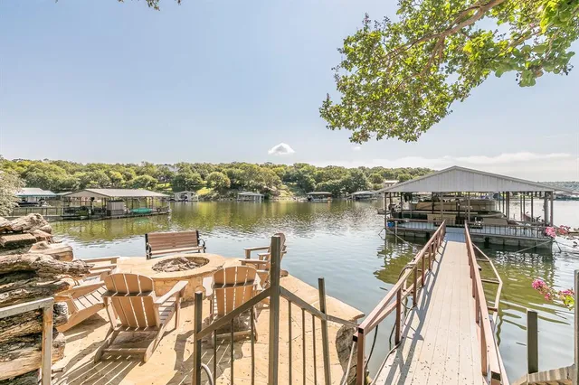 a view of a lake with houses in the back