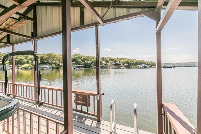 an aerial view of a house with a lake view