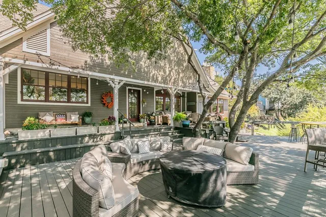 a view of backyard of house with seating space