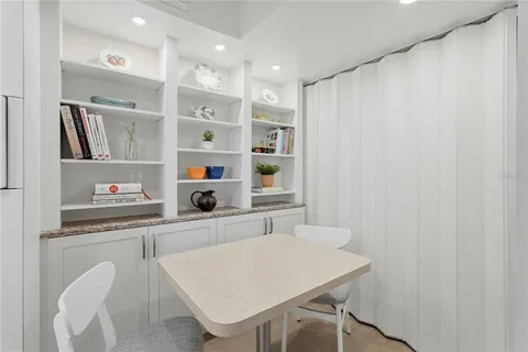 a kitchen with stainless steel appliances granite countertop a sink and a refrigerator