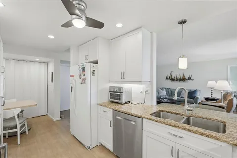 a kitchen with a sink and refrigerator