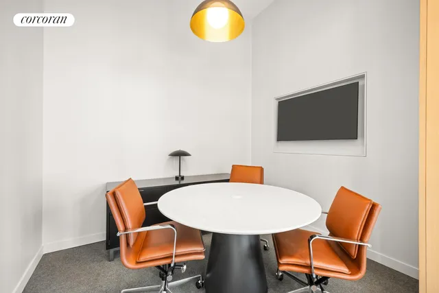 a view of a balcony dining table and chairs