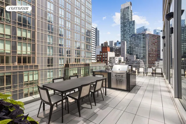 a large kitchen with a table and chairs