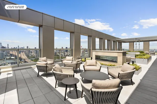 a bedroom with a bed and a large window with outer view