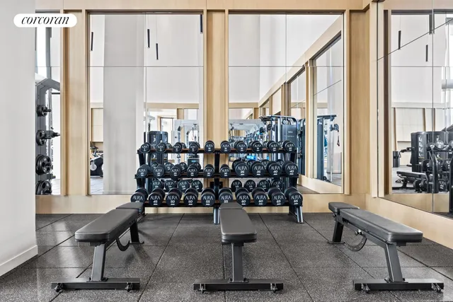 a view of gym equipment and windows