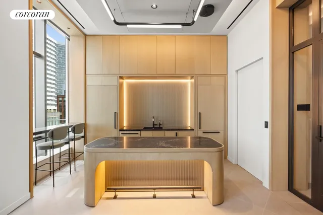 a view of an empty room with a window and a television