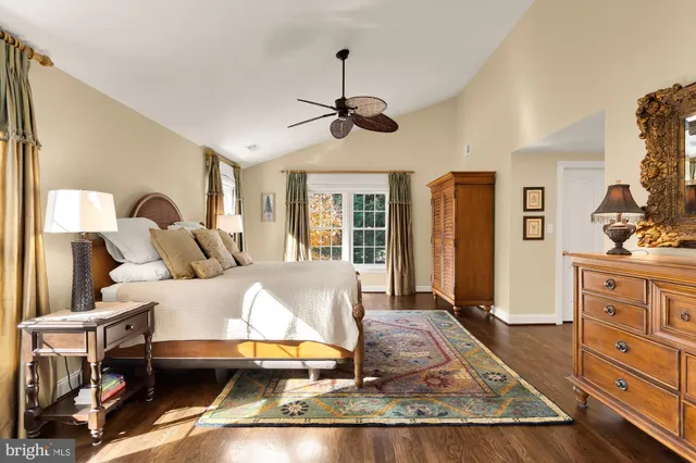 a living room with furniture and a dresser