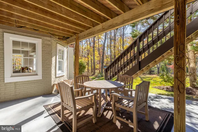a view of a dining room with furniture and window