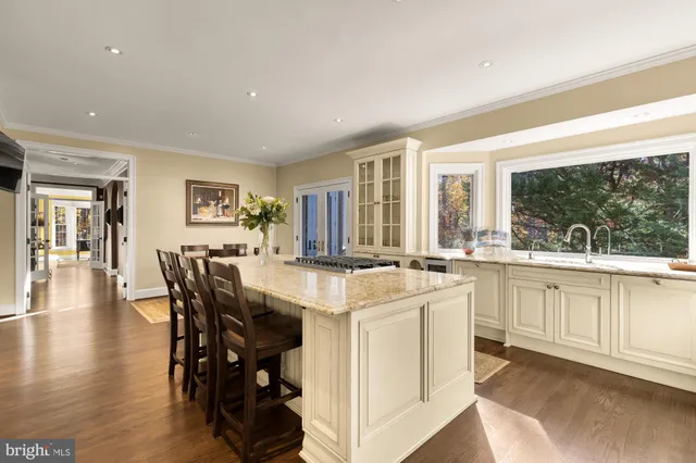 a open kitchen with center island and stainless steel appliances