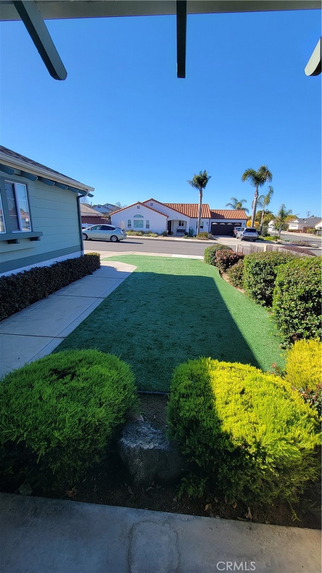 1115 Rose Court Grover Beach, CA 93433 - Photo 14 of 17 a view of a backyard with plants