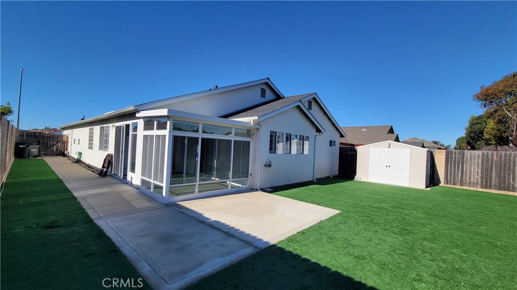 1115 Rose Court Grover Beach, CA 93433 - Photo 16 of 17 a view of a house with backyard and porch