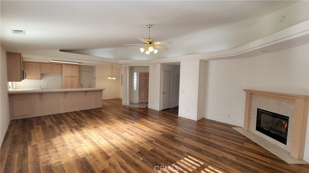 1115 Rose Court Grover Beach, CA 93433 - Photo 2 of 17 a view of a room with wooden floors and fireplace