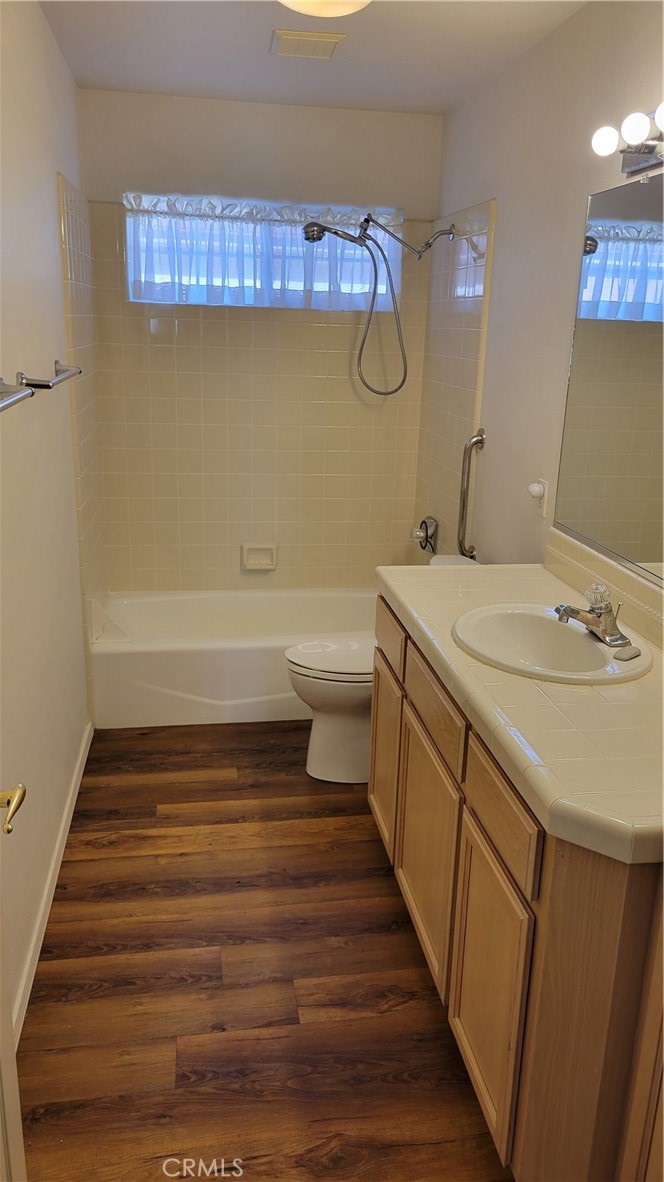 1115 Rose Court Grover Beach, CA 93433 - Photo 10 of 17 a bathroom with a sink a toilet and a bathtub