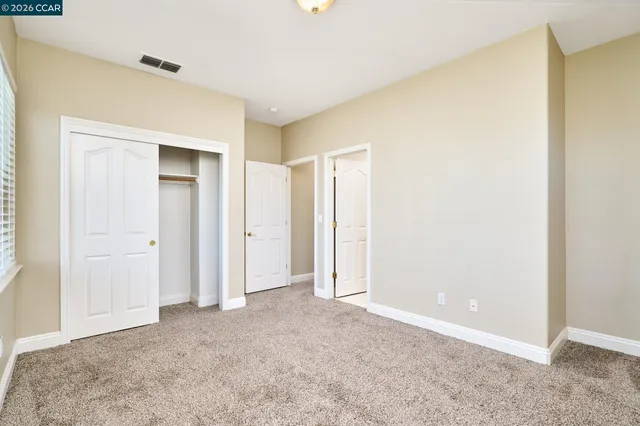 a sign board with tall buildings