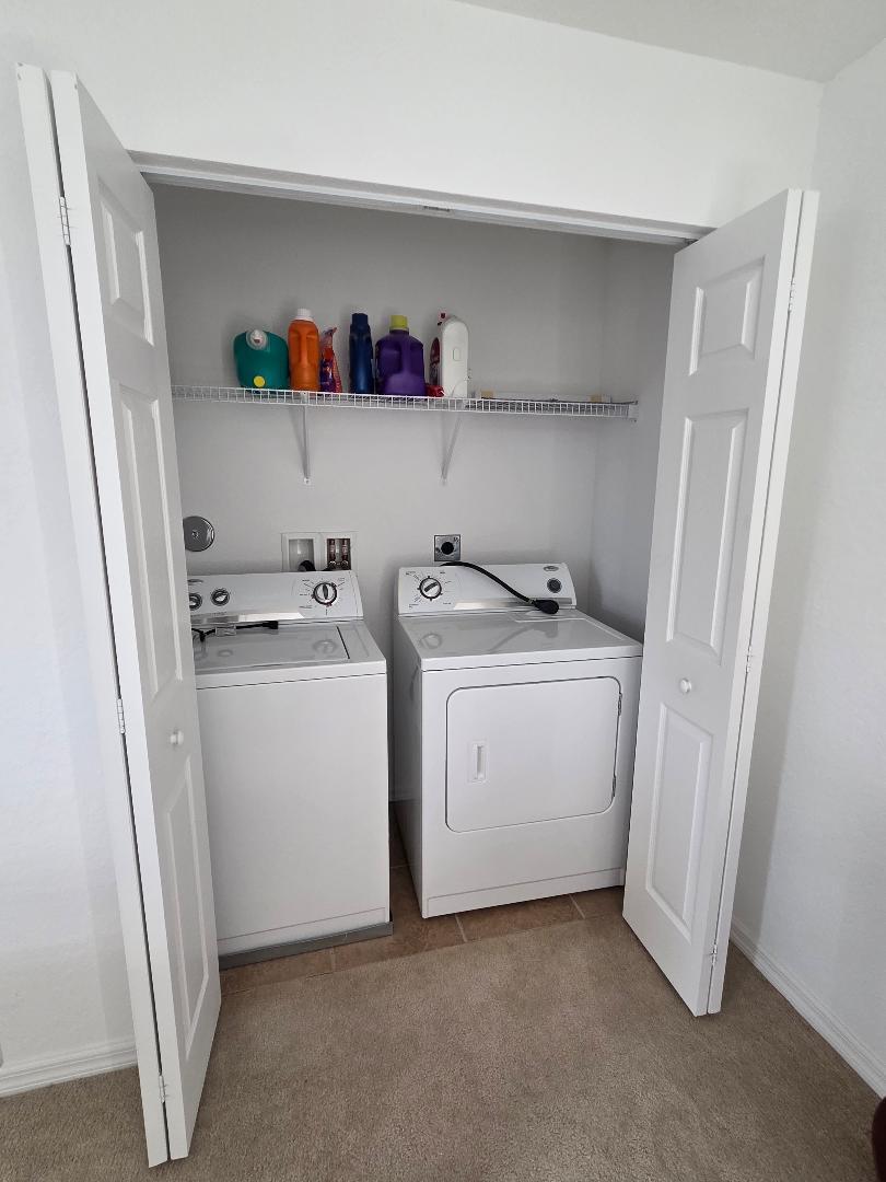 9312 Natures Way Fort Pierce, FL 34945 - Photo 13 of 16 a utility room with sink dryer and washer