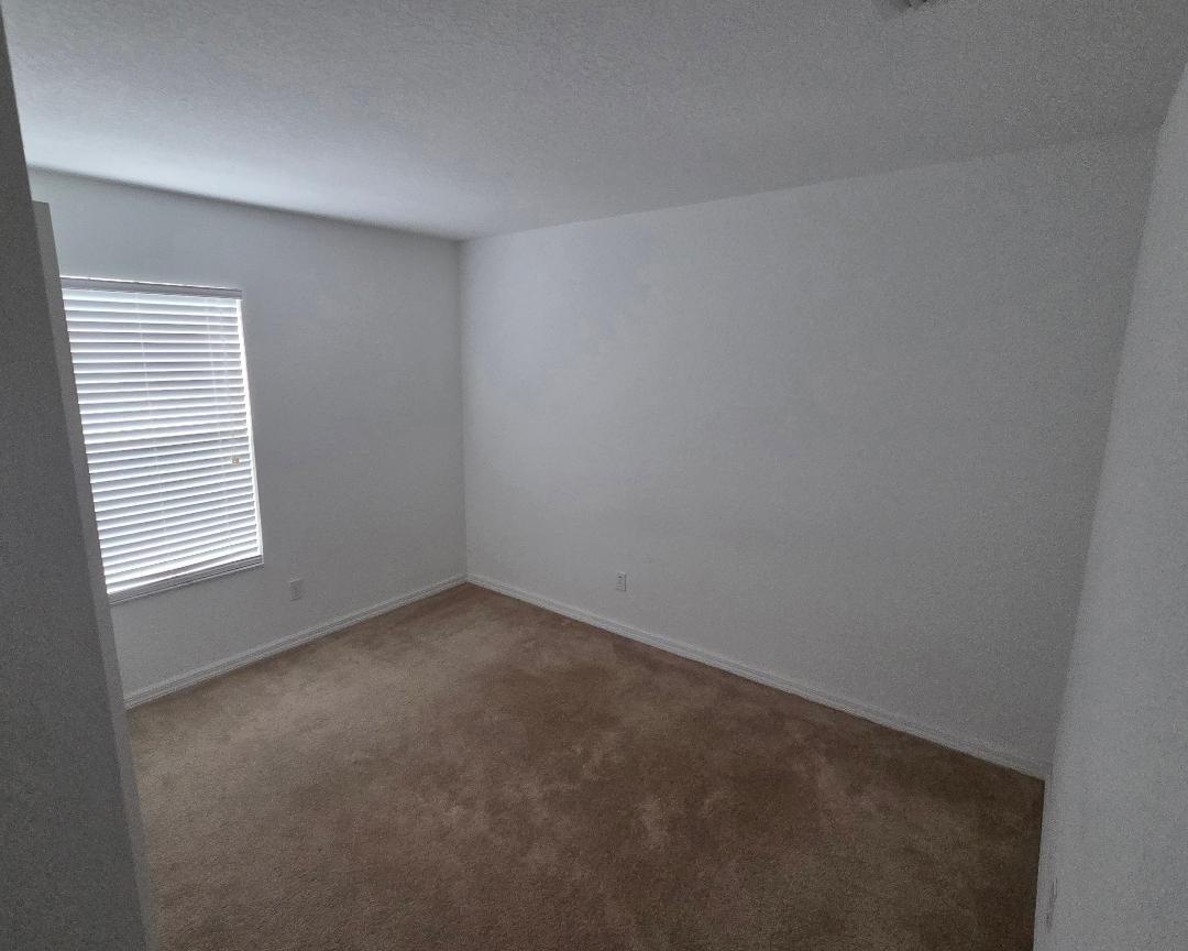 9312 Natures Way Fort Pierce, FL 34945 - Photo 9 of 16 an empty room with a window