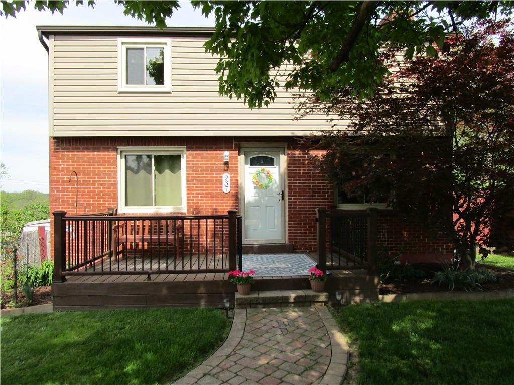 This brick and vinyl 2 story is updated from top to bottom.  The paver sidewalk leads you to the Trek deck front porch.