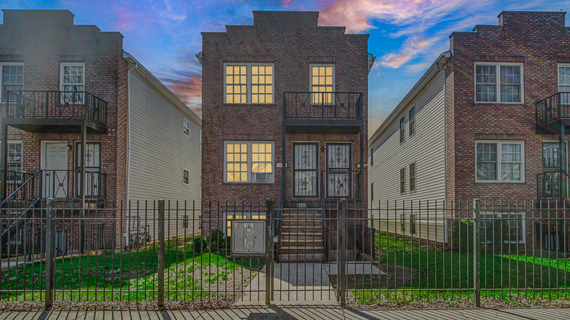 1453 East 72nd Street, Unit 3 Chicago, IL 60619 - Photo 3 of 20 a view of a brick house with many windows