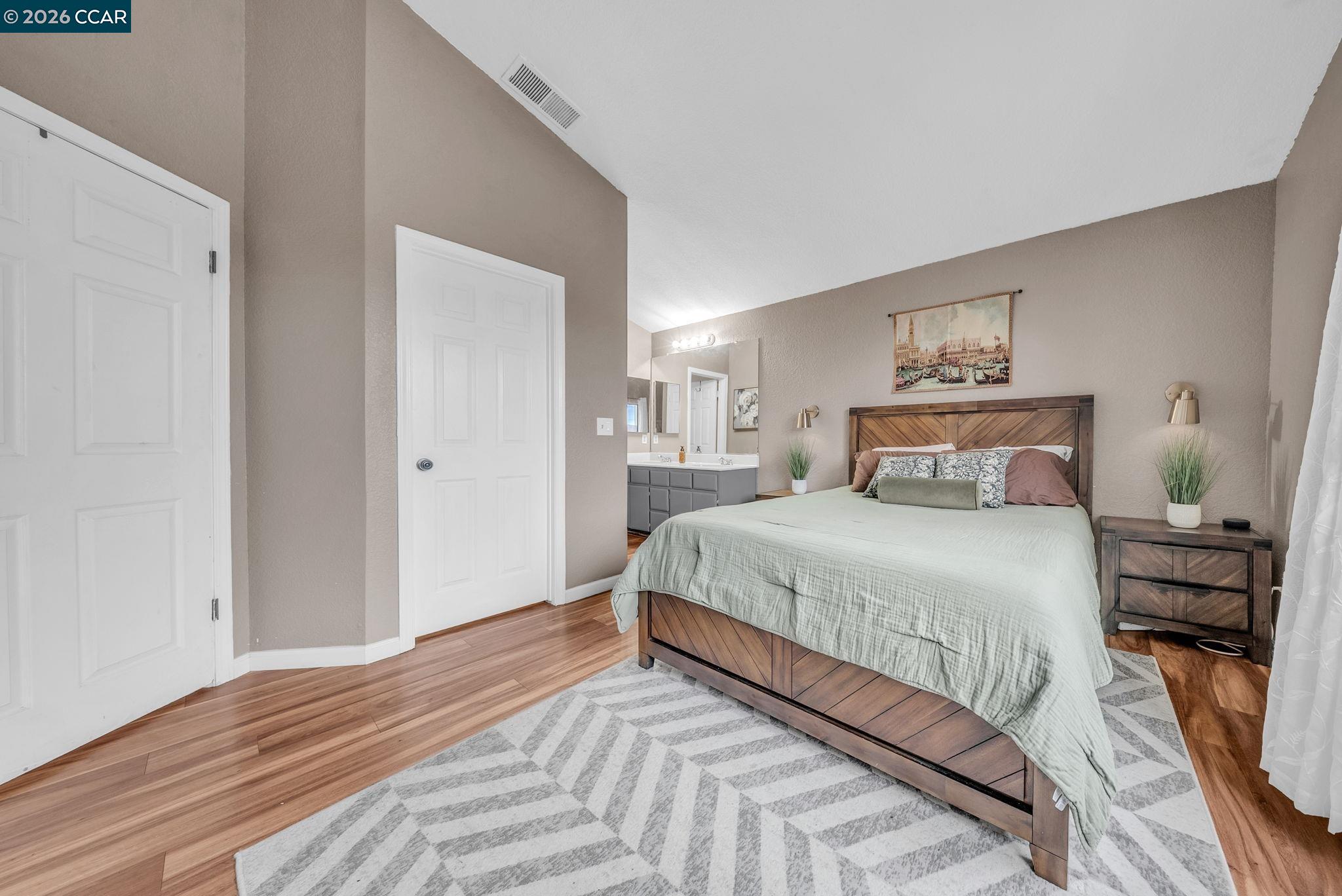 232 Case Drive Pittsburg, CA 94565 - Photo 17 of 37 a bedroom with a bed and wooden floor