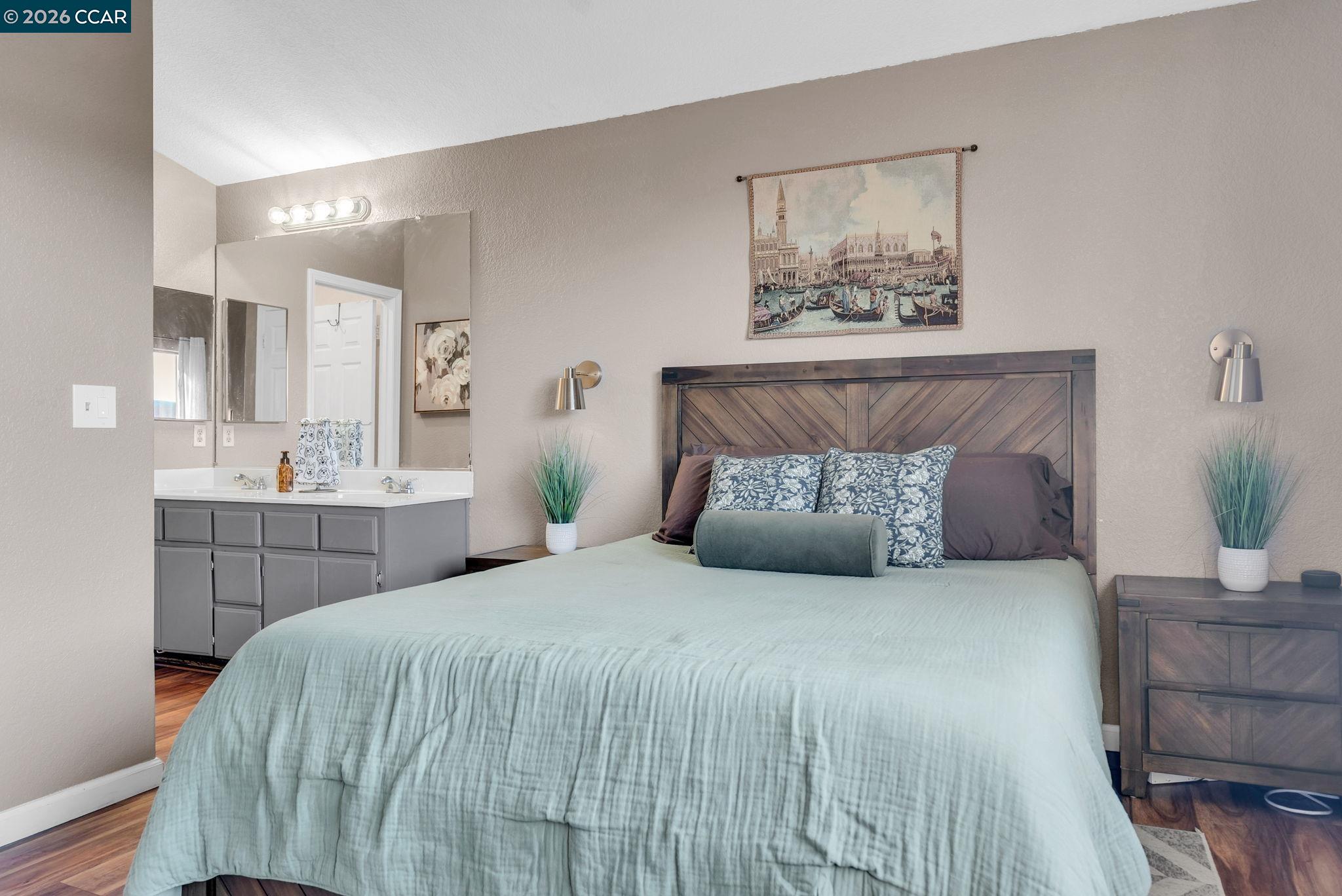 232 Case Drive Pittsburg, CA 94565 - Photo 20 of 37 a bedroom with a large bed and a potted plant