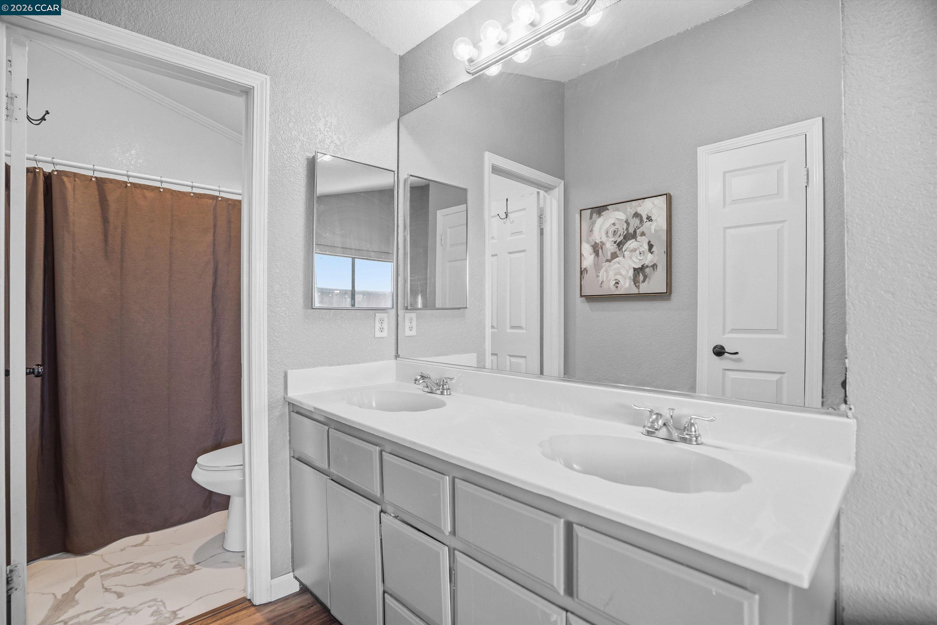 232 Case Drive Pittsburg, CA 94565 - Photo 21 of 37 a bathroom with a double vanity sink mirror and toilet