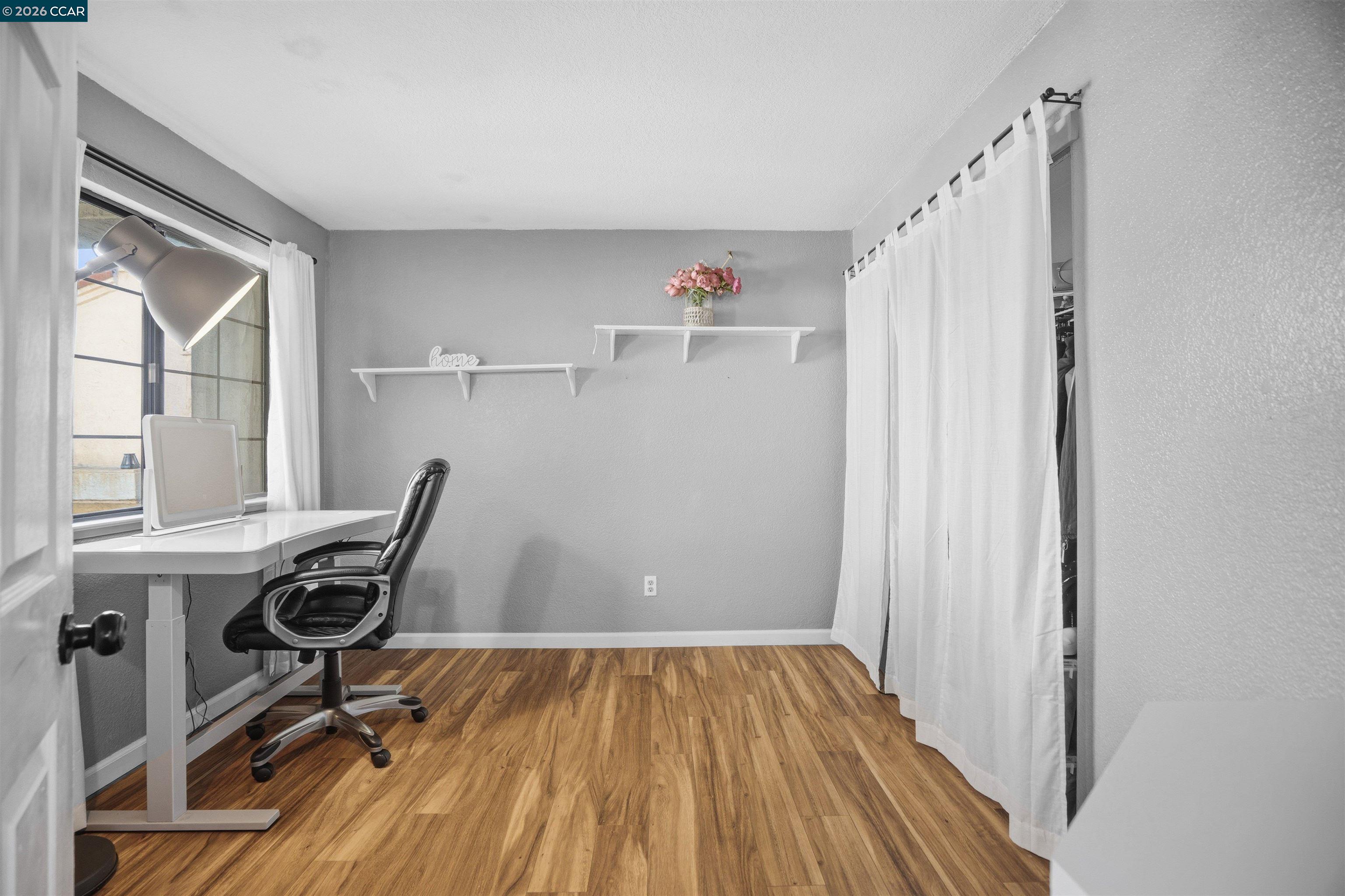 232 Case Drive Pittsburg, CA 94565 - Photo 23 of 37 a view of a workspace with furniture and wooden floor
