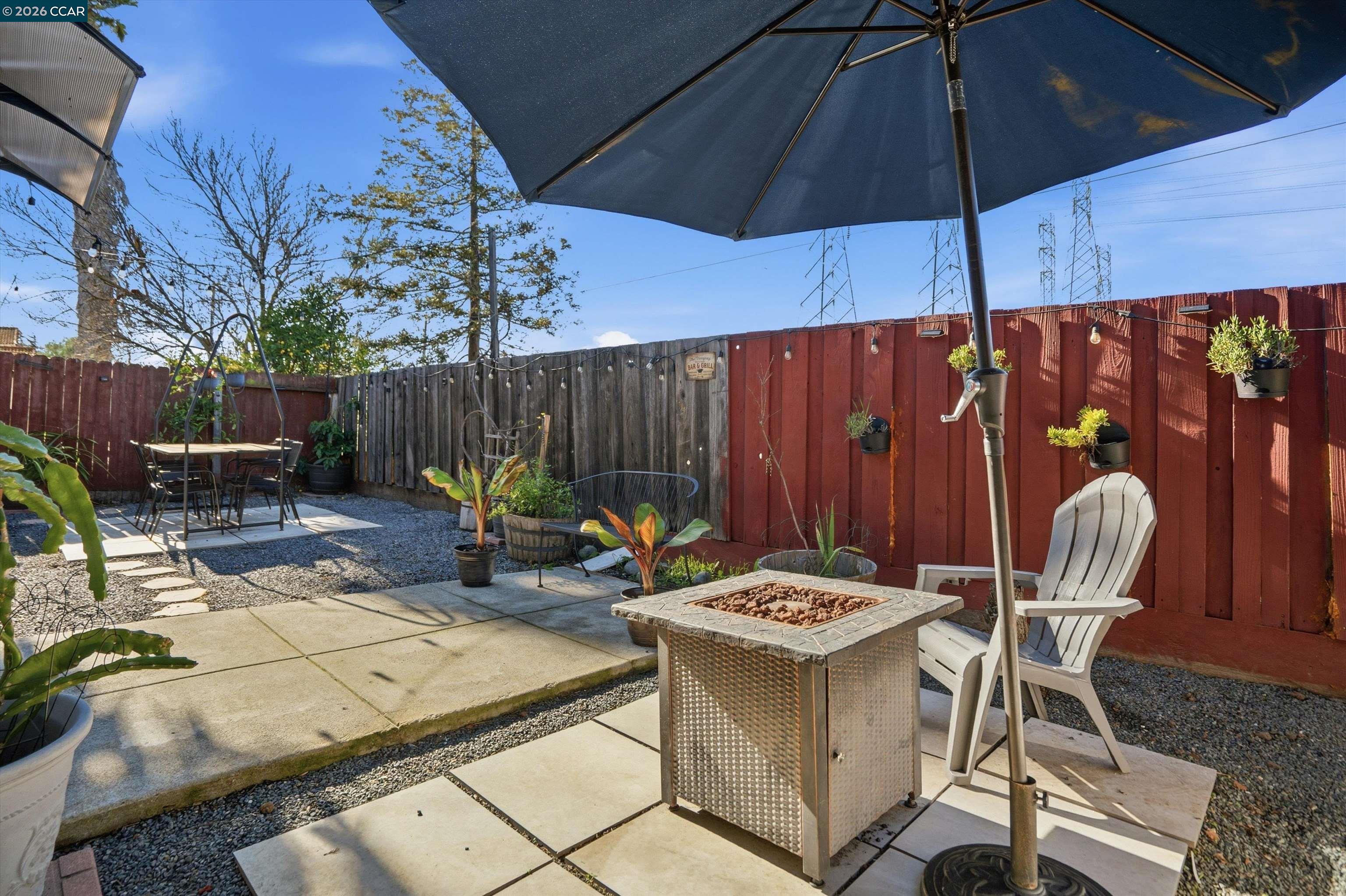 232 Case Drive Pittsburg, CA 94565 - Photo 30 of 37 a view of an outdoor sitting area with furniture and umbrella